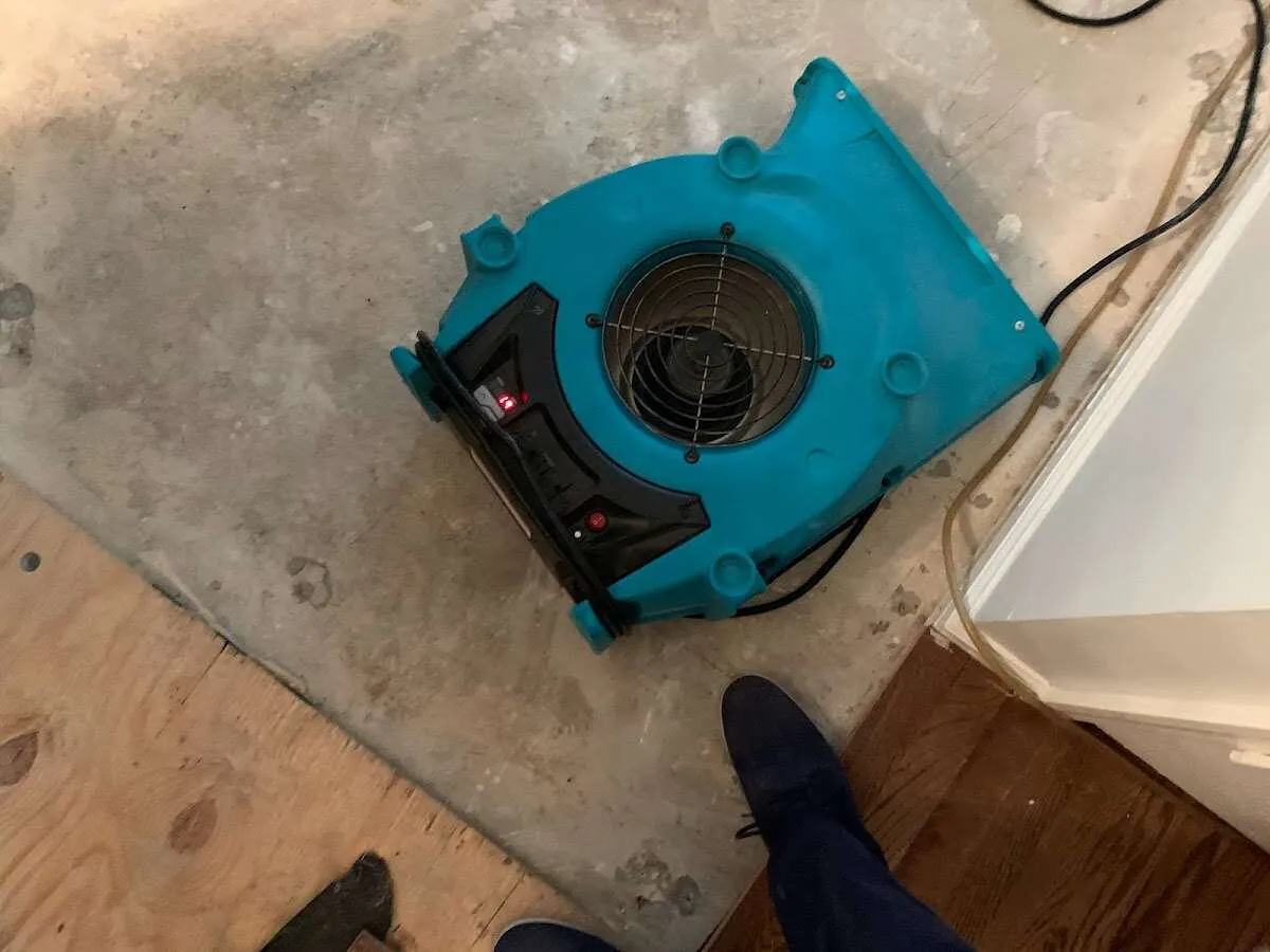 Air mover drying subfloor during Commercial Water Damage Restoration in Nellis AFB